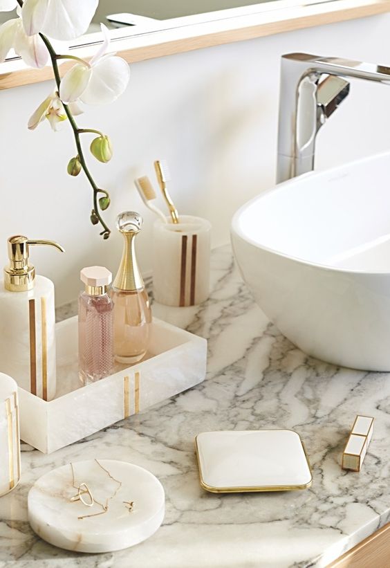 Crafted of opulent, natural alabaster, the Esme Alabaster Collection is unadulterated beauty. Intrinsic variations in the grain and color of the semi-translucent stone ensure each piece will be unique. Linear brass accents enhance the aesthetic value.
