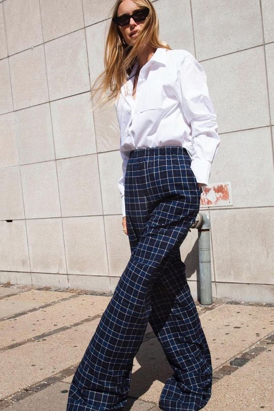 Secrets of stylish people: Pernille Teisbaek wearing a white shirt and checked trousers