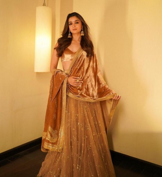 Alia Bhatt glams up in a gold lehenga set for "RRR" promotions!