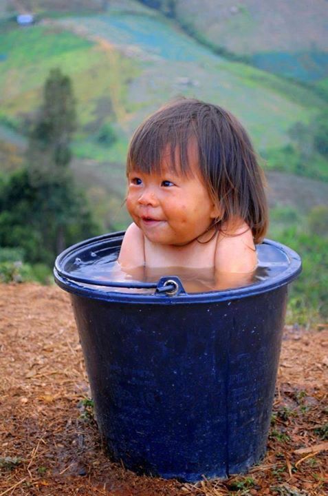 Funny bath time in tummy tub