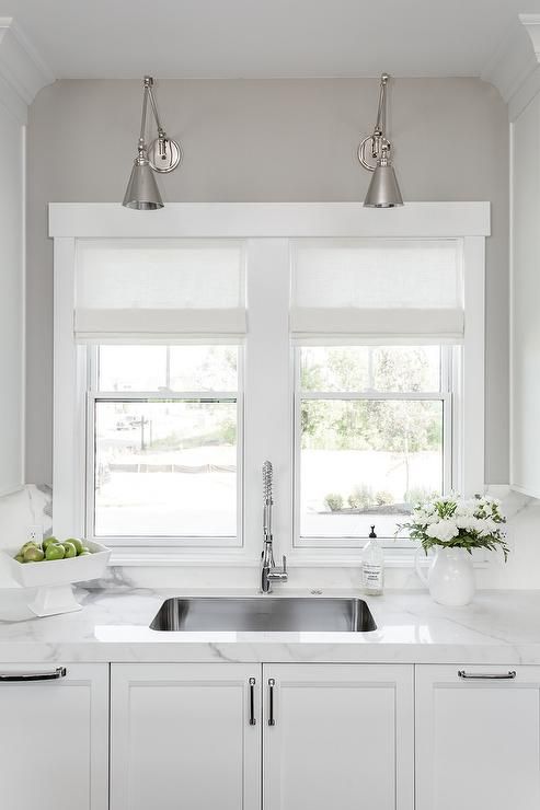 An Undermount Curved Stainless Steel Sink Accented With A Pull Out Polished Nickel Faucet Its Kitchen Design Replacing Countertops Curved Kitchen Sink, Polished Nickel Chandelier Kitchen Sink