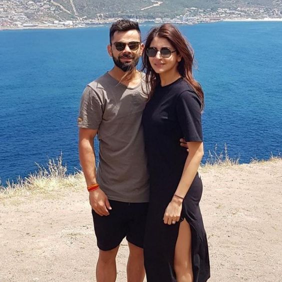Anushka Sharma & Virat Kohli’s latest photo is a visual treat as they pose at a picturesque spot