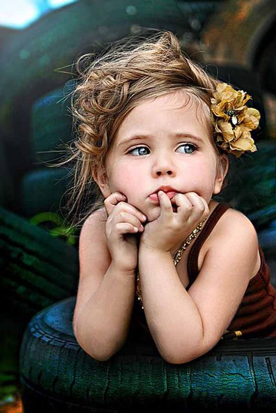 Beautiful toddler deep in thought with flower in hair. #toddler #child #photography #meditative