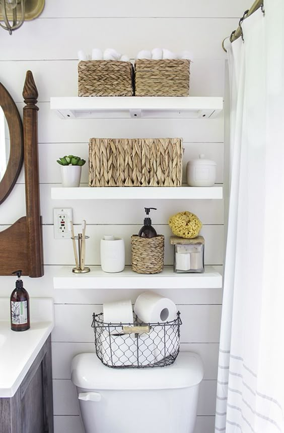 After they re-sheetrocked the walls, the couple installed inexpensive, faux shiplap on top and painted the entire room white. Rachel cleverly chose paint with a satin-finish so that light entering the bathroom would reflect from any angle, making the bathroom appear larger.