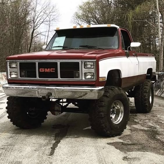 Old Lifted Red and White Classic GMC Truck