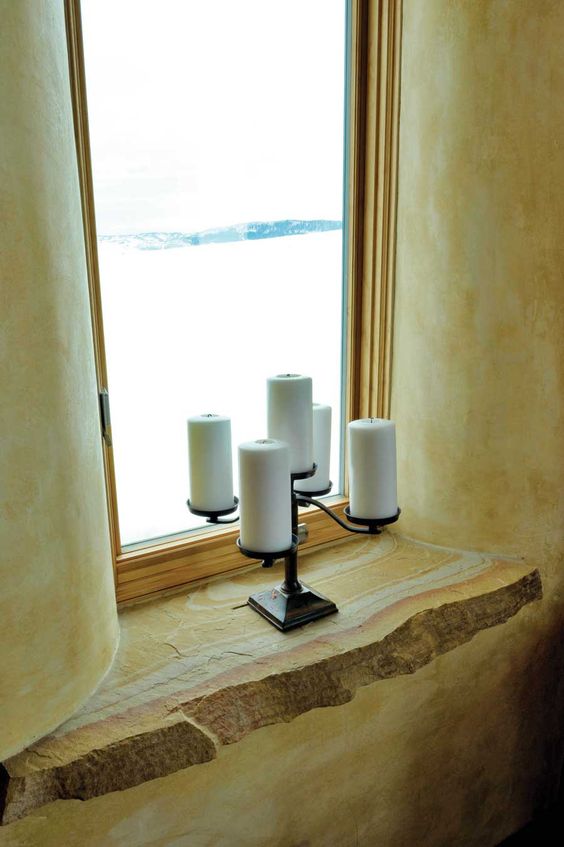 Straw bale walls offer deep windowsills reminiscent of European homes.