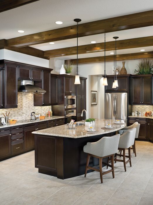 Rutenberg Lakeland Luxury Designer Home Rustic Kitchen With Dark Ceiling Beams Island Counter Seat Curved Rustic Kitchen With Dark Ceiling Beams, Lakeland Kitchen Island