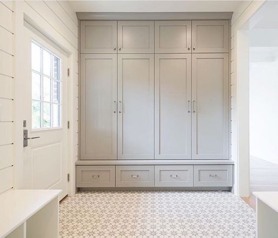 A beautiful mud room with built-in cabinetry, cement tile flooring, and shiplap walls. Design by Bria Hammel Interiors. #mudroom #cementtiles #Scandinavian #lightgrey