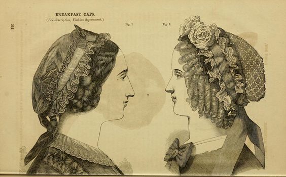 1863 Godey's. "Breakfast caps. 1. ...of French muslin trimmed with violet ribbons. 2. ...in the form of a net trimmed all round with a double row of blonde; two ribbon streamers behind. Three roses make a pretty bandeau to the front of the cap. Black or white net may be used for the purpose, and whatever colored ribbon best suits the complexion of the wearer." [jrb]