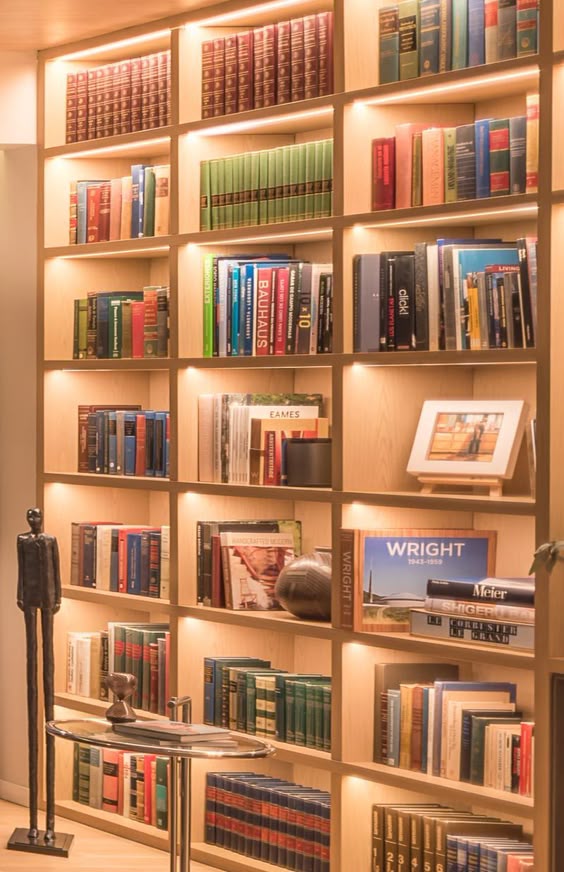 A Full Wall Of Shelving With Hidden Lighting Is A Bright Idea For This Living Room