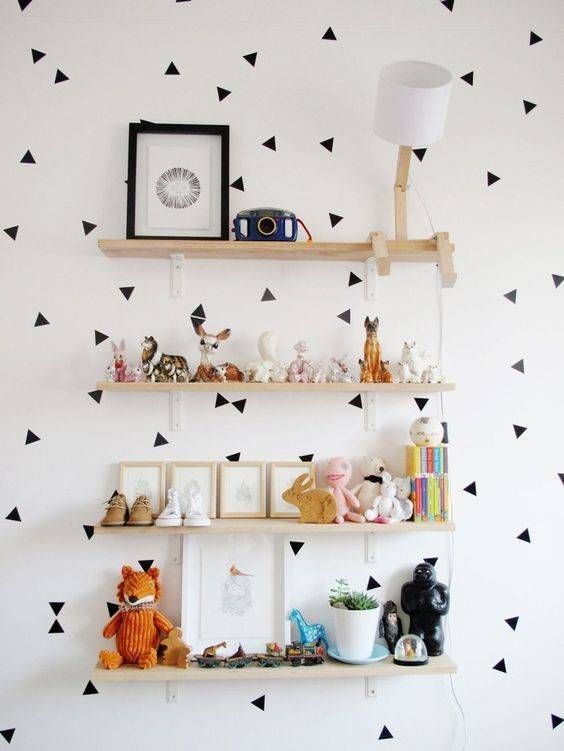 Stencil random triangles on the wall - so cute!  kids room design black and white polka dot wallpaper and mounted shelves