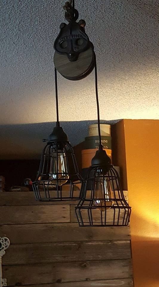 Found the pulley from Hobby Lobby and the light fixtures from Home Depot .. had my friend wire them togeth… | Rustic light fixtures, Light fixtures, Rustic lighting