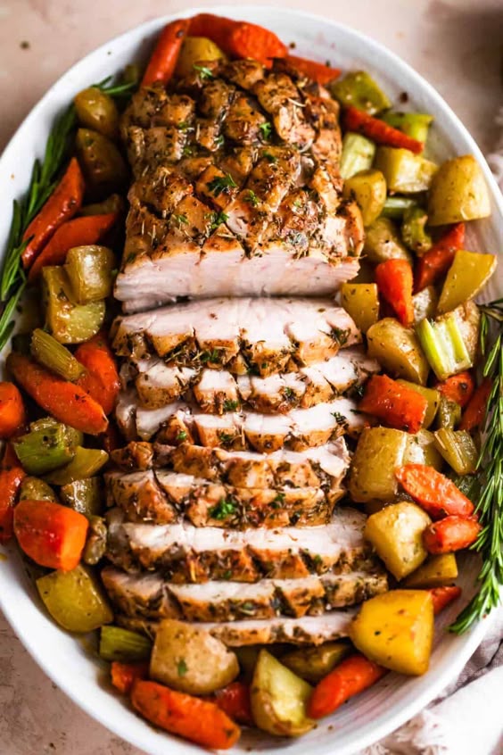 This easy recipe for Pork Loin Roast with Veggies is a complete dinner that’ll wow your dinner guests! Fragrant with olive oil, garlic and herbs, this one’s a delicious keeper.