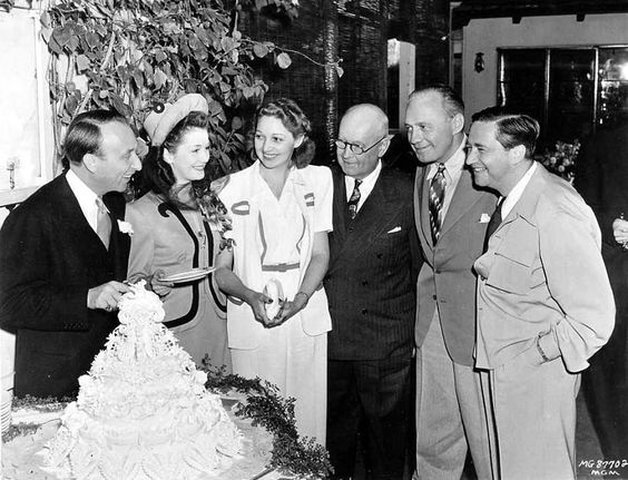 Producer Joe Pasternak and Dorothy Darrell celebrate their wedding with Mary Livingstone, Judge Guy Pinney, Jack Benny and Mervyn LeRoy