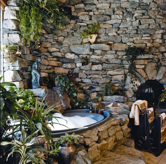 Stone bathroom—the homeowners recoated a plain white tub with a truck-bed liner so it would look more like stone and have a safe, non-slip surface.