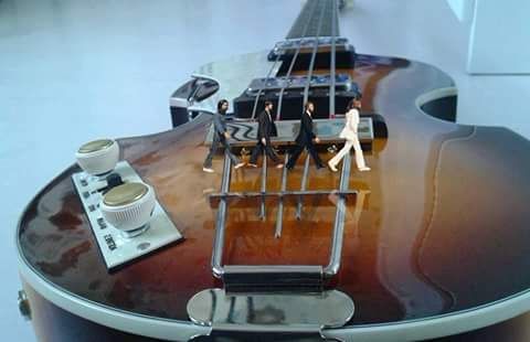 ABBEY ROAD ON THEIR GUITAR