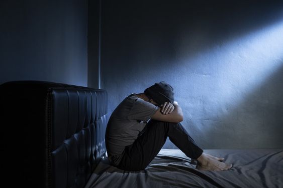 Sad man in the dark room | Photo Download