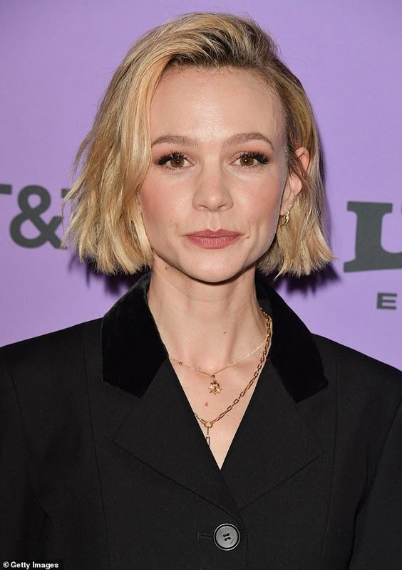 Carey Mulligan cuts a sophisticated chic look in a peplum black suit