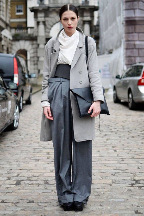 Who: Showgoer on the way to the Jasper Conran show What: Varying shades of gray break up the levels of this tailored ensemble. Wear: H&M coat, Margiela pants, Weekday belt, Pap Accessories bag - ELLE.com