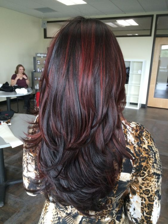 Layered Black Waves With Muted Cherry Highlights Hair Color For Black Hair Hair Highlights Black Hair With Highlights