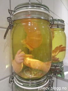 Jars + tinted water + doll parts = Creepy "Specimen" decorations for halloween