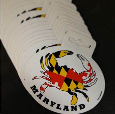 Crab cakes and football: That\'s what Maryland does. Our friends at online decal and magnet retailer FishOutaWater.com are honoring their home state with these slick, seafood- and state flag-inspired stickers. Visit their site to see their take on your home state. --> http://www.fishoutawater.com/