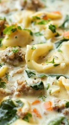 Creamy Sausage and Tortellini Soup ~ A bowl full of comfort... It’s loaded with veggies, sausage and cheese tortellini- plus it comes together in just 45 minutes!