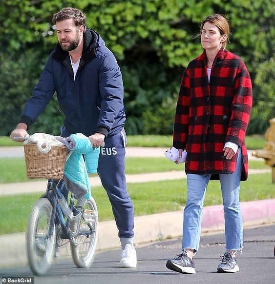 Cobie Smulders takes a stroll around the neighborhood with her family