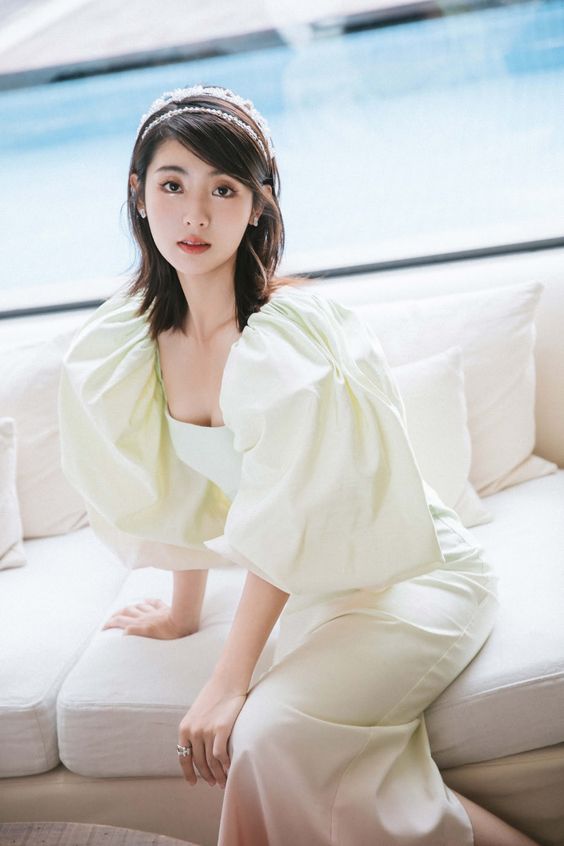 Xing Fei poses for photo shoot