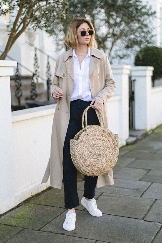 Oversized trench coat, white shirt, navy chinos, white sneakers, round aviator sunglasses, circle straw tote. #trenchcoat #ss18 #springstyle #streetstyle #stylish #fashion2018 #fashiontrends2018 #ootd #outfitideas #outfitinspiration #casualstyle #comfystyle #sneakers #whiteshirt #basics spring casual outfit, trench coat outfit