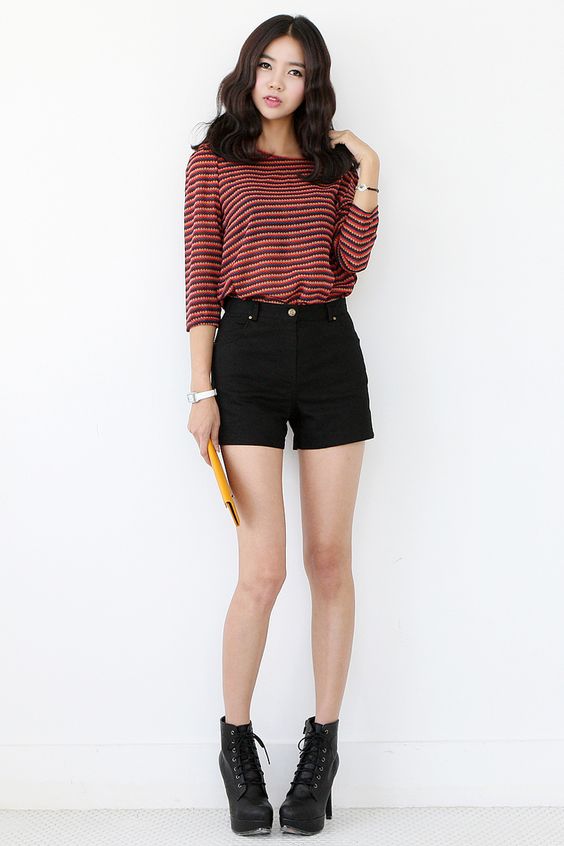 Striped shirt paired with simple black shorts and a pair of boots/sandals