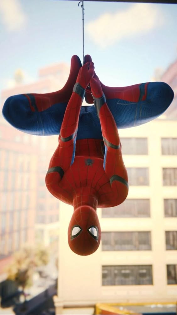 Spider-Man hanging upside down