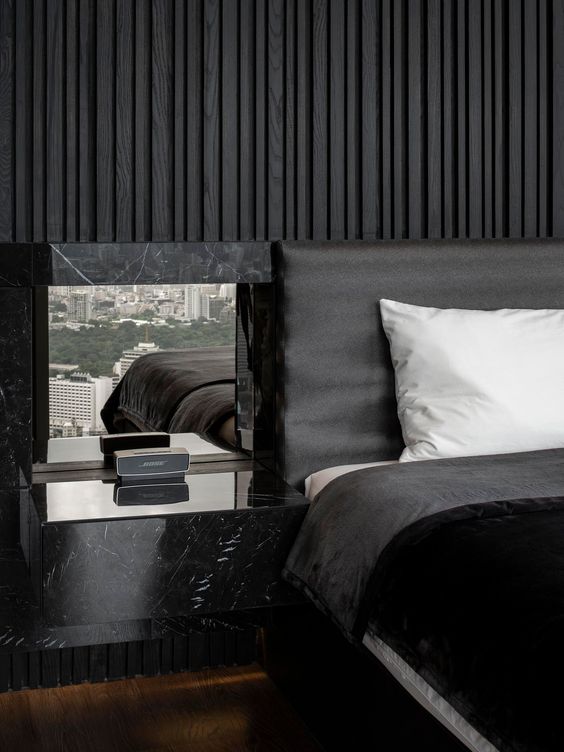 This Bedroom’s Textured Accent Wall Was Made With A Variety Of Black Stained Vertical Wood Slats