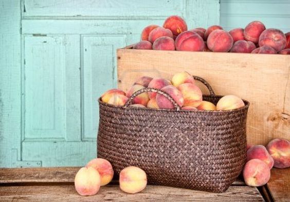 Many peaches in wooden crate and basket with antique panel background Stock Photo - 15252197