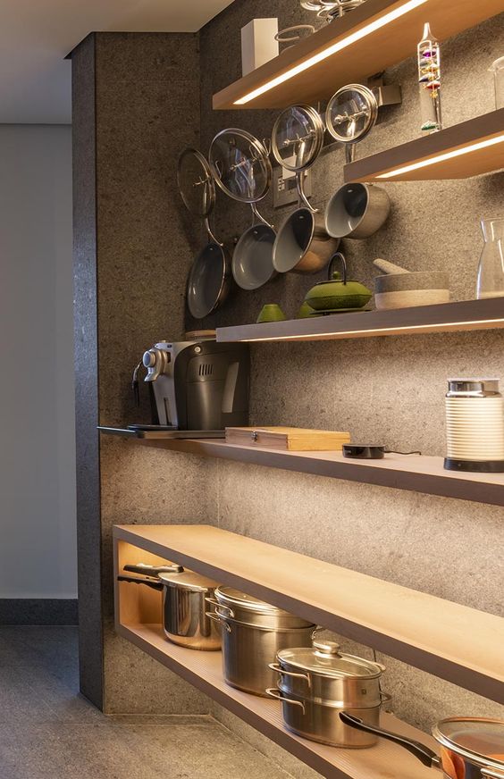 Use Hidden Lighting Under Shelves To Create A Dramatic Wall