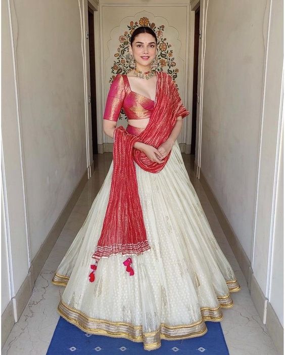 Aditi Rao Hydari is a resplendent wedding guest in an ivory lehenga!