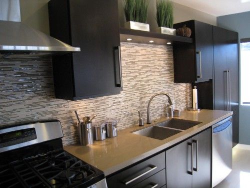 Backsplash and counters are similar to mine. I like how it looks with the dark wood. This is so confusing!