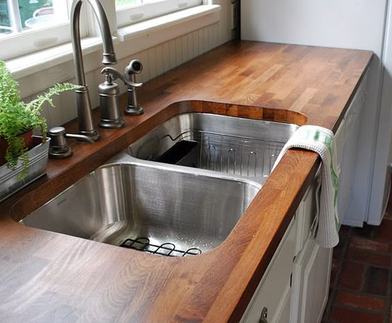 How to buy standard Ikea butcher block counters and make them all fancy. Edit: We did this! Not too hard, just time-consuming.
