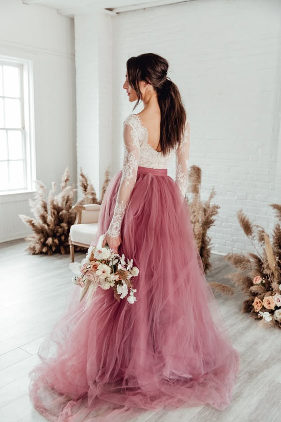 The Norma J skirt is for the romantic at heart. Five layers of individually gathered tulle create an angelic and frothy halo for your wedding day style. Colored skirts feature three layers of the shade of your choice, with two layers of soft white over top for magical depth and dimension. The Norma J skirt has a satin shell and is fully lined. Each skirt features a 9-12" left side zipper. This listing is for the Norma J. skirt only, all tops are sold separately. We kindly ask that you read throu