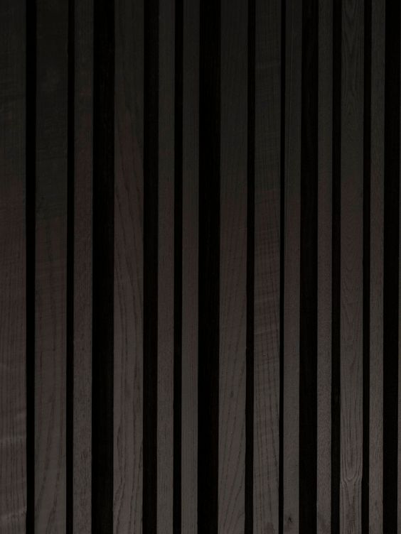 This Bedroom’s Textured Accent Wall Was Made With A Variety Of Black Stained Vertical Wood Slats