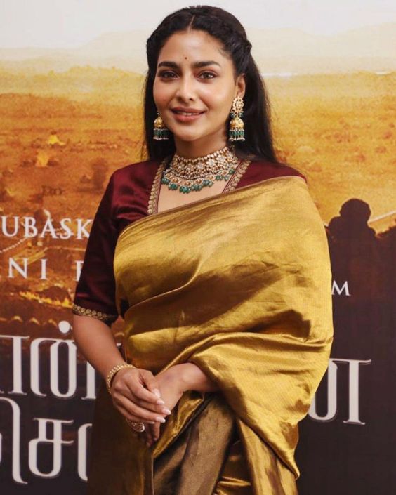 Aishwarya Lekshmi shimmers in a gold silk saree at "PS-1" teaser launch!