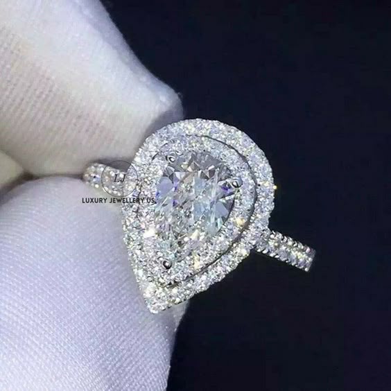 2.00 CT Pear Cut Diamond Engagement Ring, Solitaire With Accent Ring, Women\'s Wedding Ring, Halo Ring, Ring For Wedding, 925 Silver Ring ● Ring Description and specifications ● Main Stone: Lab Diamond/Moissanite Main Stone Shape : Pear Cut Main Stone Weight : 2.00 Carat ( Approx ) Side Stone: Lab Diamond/Moissanite ● Customized your desire jewelry with us ● ● Luxury Jewellery happily accept customized or personalized orders from our customers. ● We can make jewelry in 10K, 14K, 18K Gold. ● We ca