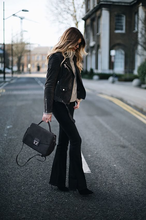 Emma Hill wears black flares, grey suede biker jacket, chic winter outfit
