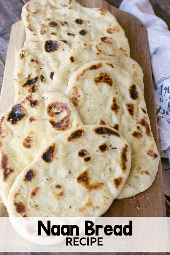 Naan is a traditional Indian flat bread that is pillowy soft and delicious. This easy naan bread recipe calls for plain yogurt, egg and is brushed with melted butter when the naan comes off the cast iron skillet. Homemade naan bread will outshine sore bought every time. #naan #naanrecipe #easyrecipe #STGRecipes #indianfood #flatbread #easyrecipe