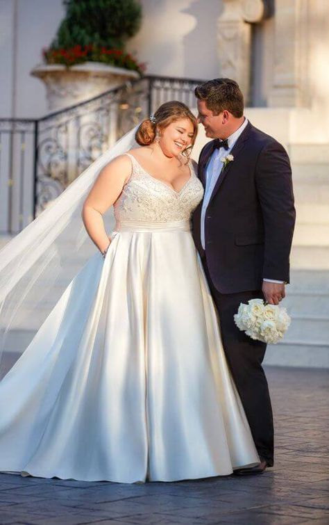 Turn heads on your wedding day in this beautiful plus size wedding gown