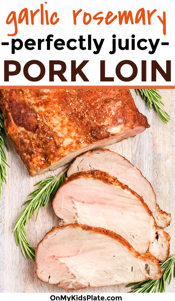 Oven roasted pork loin from above sliced with rosemary sprigs.