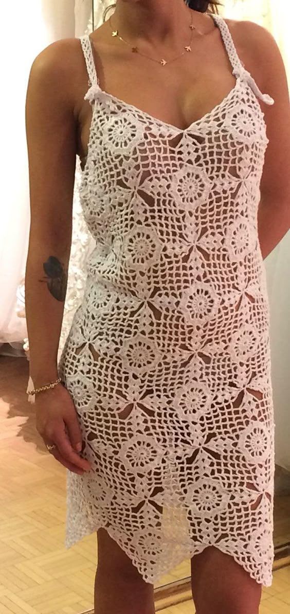 A white dress with floral patterns. This dress was made with beach clothing in mind but can be worn on any occasion you might see fit. Made with 100% microfiber acrylic. Size for this product is M but due to the material used and the type of the crochet, it is quite elastic and fits