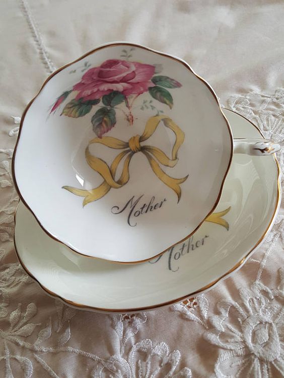 This would make a wonderful Mothers Day or Mom-to-be gift! Vintage Paragon china tea cup and saucer, made in England. White background with a solo pink cabbage rose and a script font that reads Mother on the inside of the cup. It is in good condition, no chips, cracks or