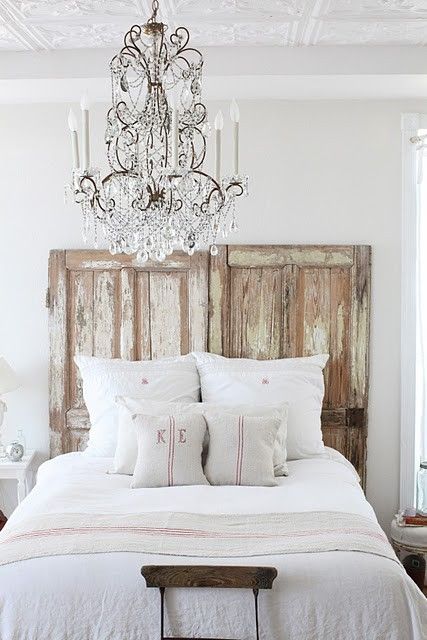 Dreamywhites bedroom with vintage weathered doors as headboard. Romantic European Farmhouse Bedroom Decor Ideas! #rusticdecor #frenchfarmhouse #bedroom