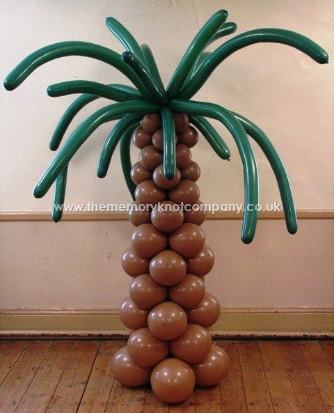 We made these palm tree balloon columns to fit a pirate theme